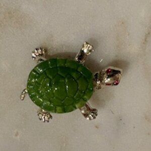 Turtle brooch-Silver tone metal body-Green enamel on the shell-Red stone eyes